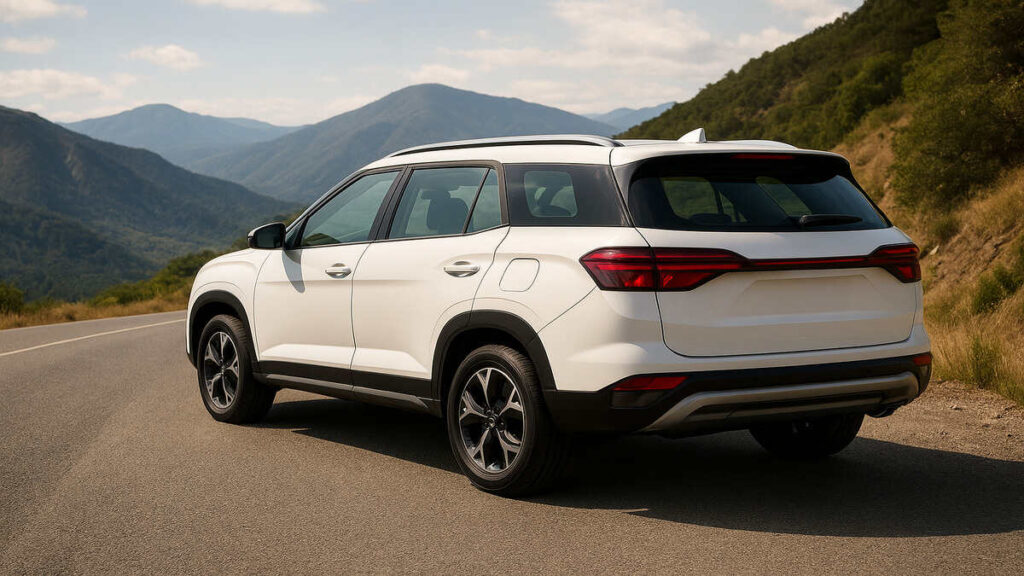 "Atlas White Hyundai Alcazar photographed from the rear on a scenic mountain road in daylight."