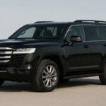 Toyota Land Cruiser 300 black colour front view on plain background